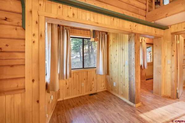 a view of front door with wooden floor