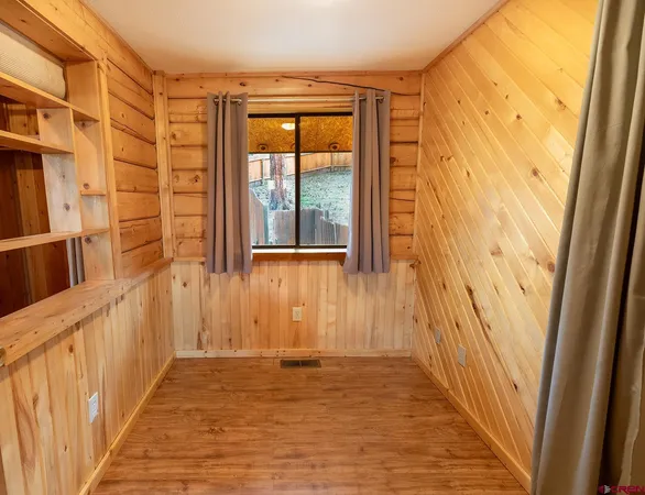 a view of front door and wooden floor