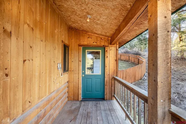 a view of a porch with wooden floor and stairs