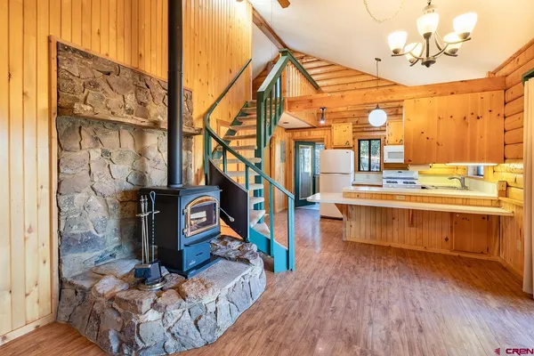 a view of entryway with a room and wooden floor