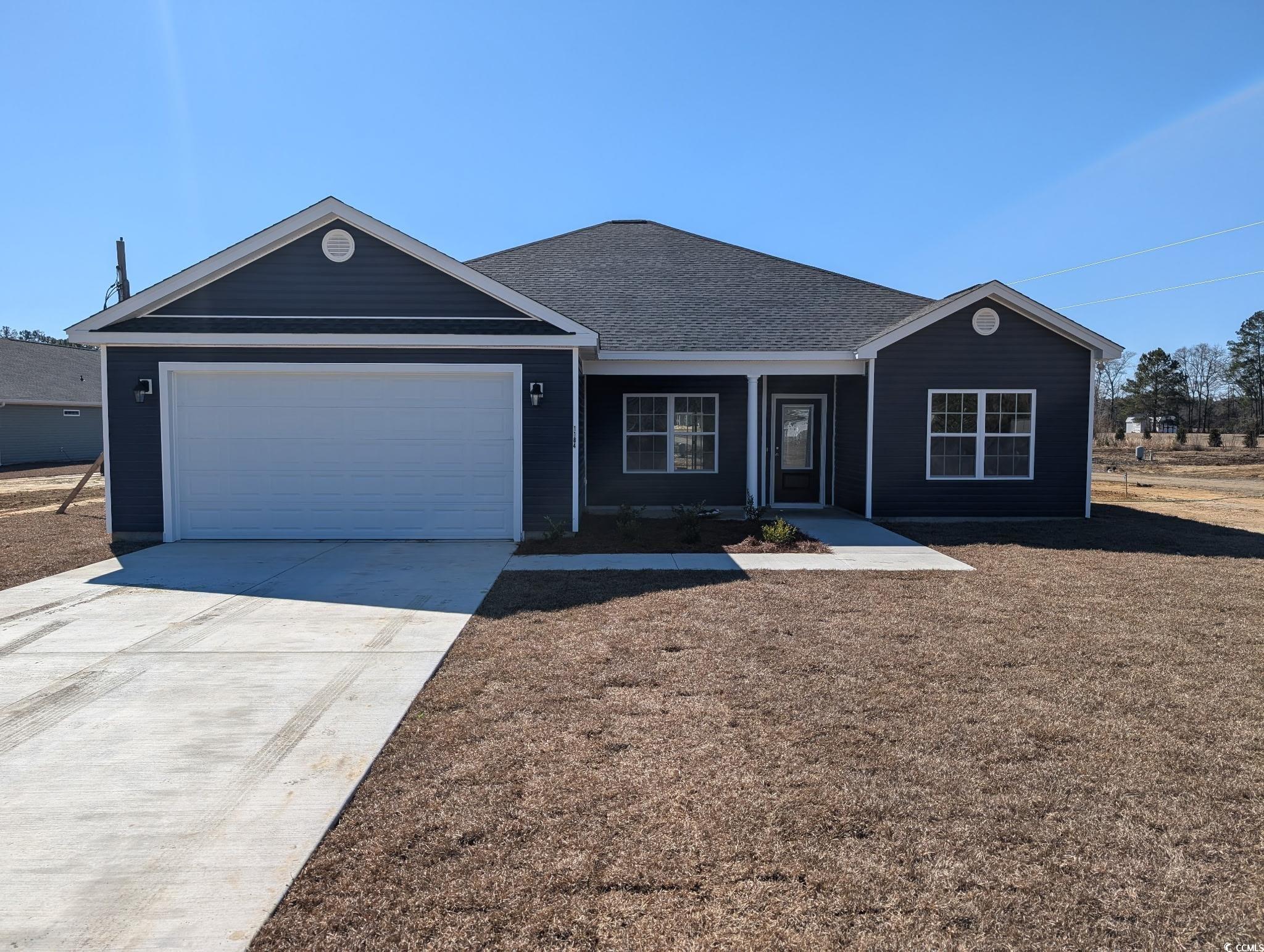1184 Justice Loop Loris, SC 29569 - Photo 1 of 1 Ranch-style home with driveway, a shingled roof, a