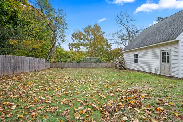 a backyard of a house with lots of green space