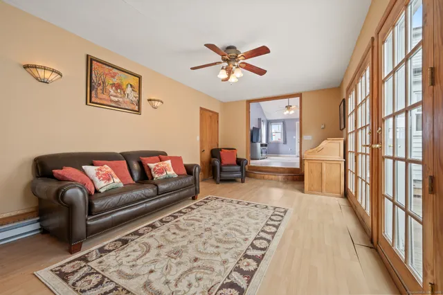a living room with furniture and a rug