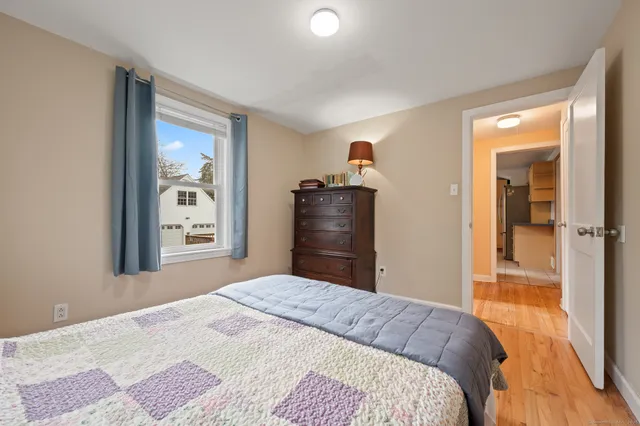 a bedroom with a bed and a dresser