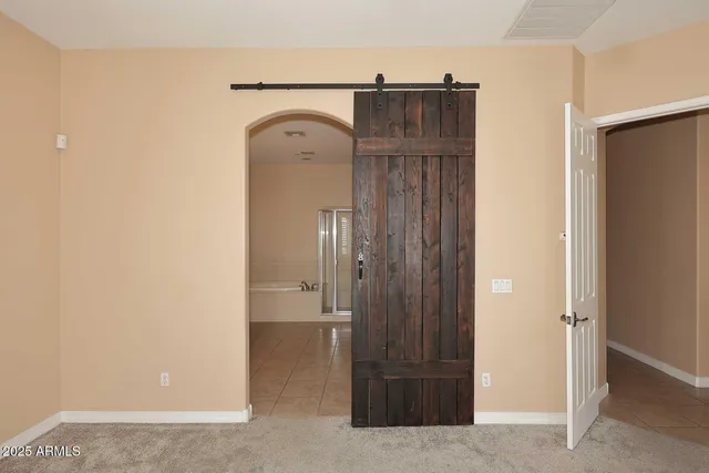a view of entryway with wooden door