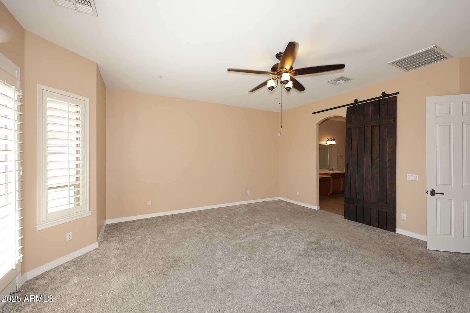 2007 East Topeka Drive Phoenix, AZ 85024 - Photo 14 of 34 a view of a room with a ceiling fan and a window