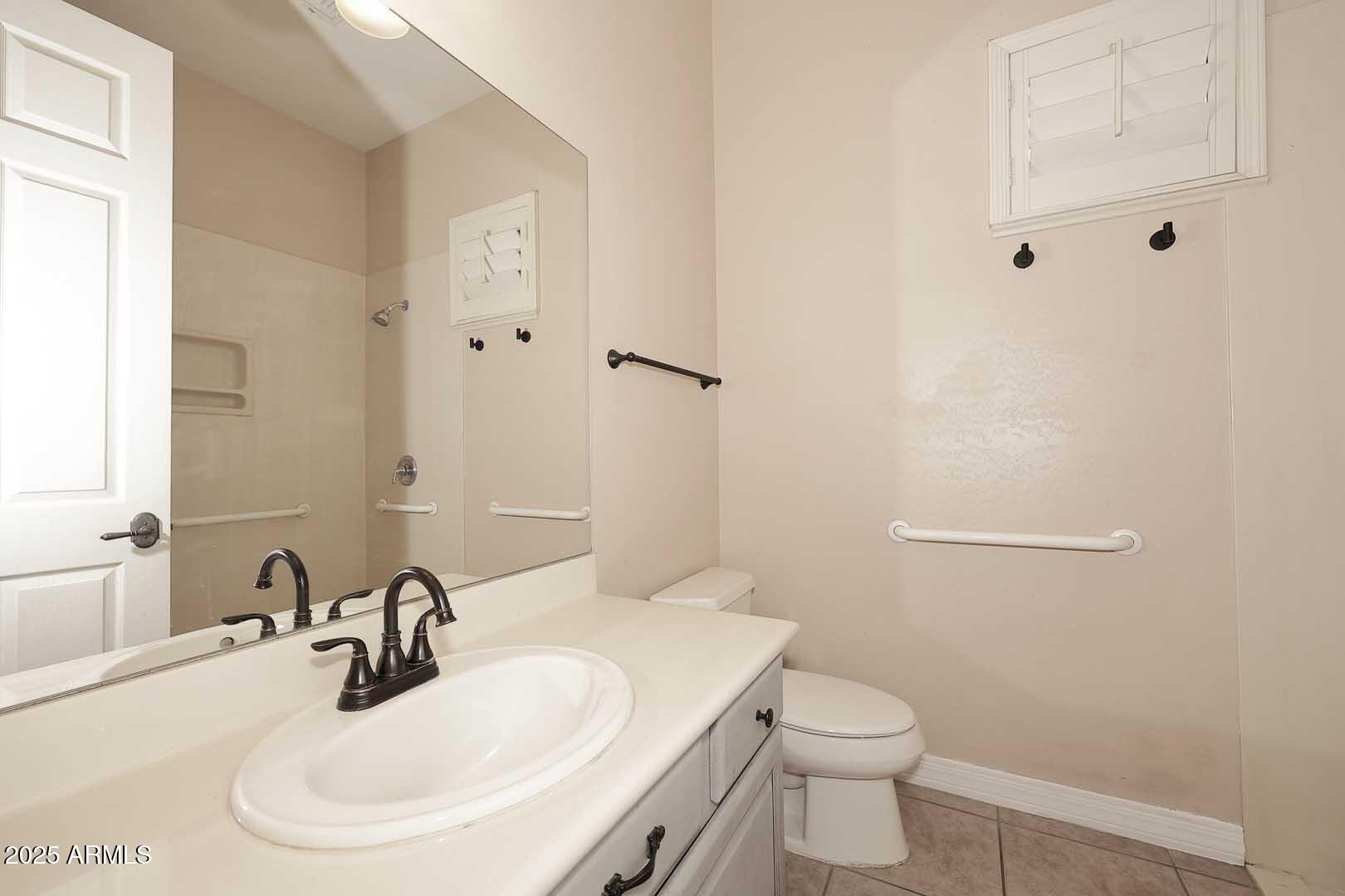 2007 East Topeka Drive Phoenix, AZ 85024 - Photo 21 of 34 a bathroom with a sink a toilet and mirror