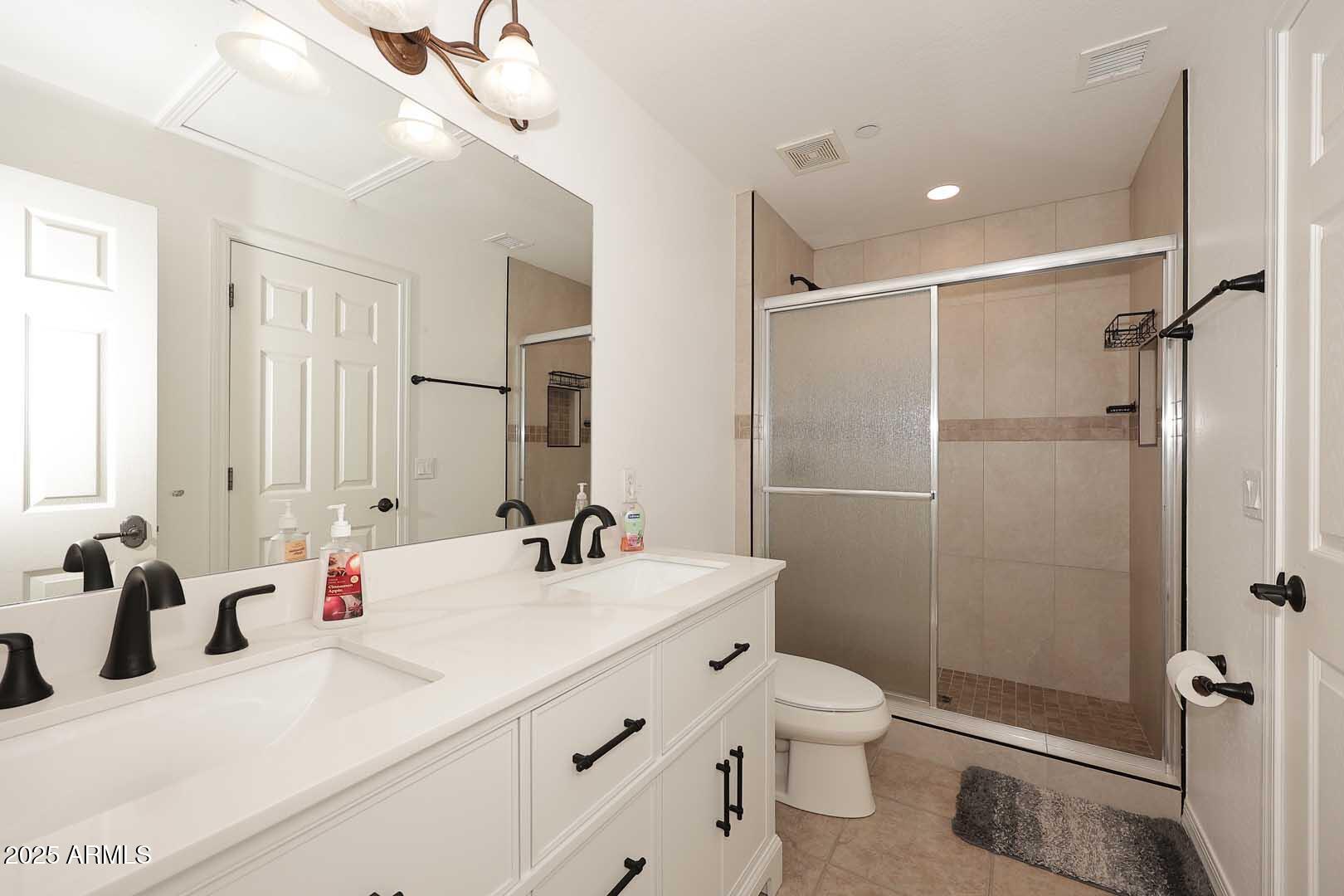 2007 East Topeka Drive Phoenix, AZ 85024 - Photo 24 of 34 a bathroom with a sink toilet double vanity and shower