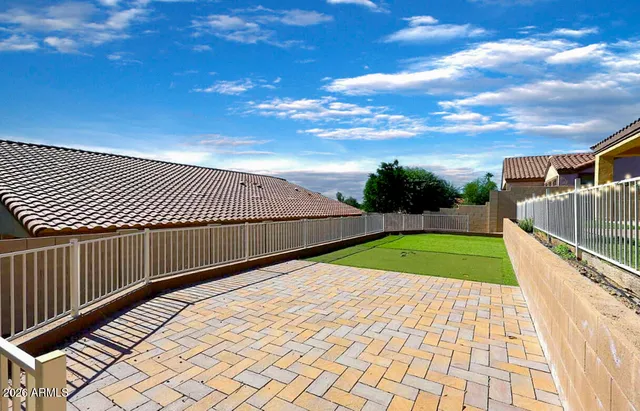 a view of swimming pool and deck in the backyard of house