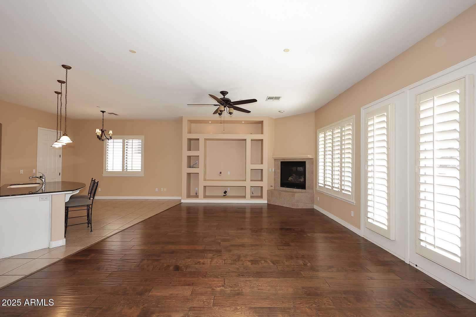 2007 East Topeka Drive Phoenix, AZ 85024 - Photo 5 of 34 a view of an empty room with a window and wooden floor