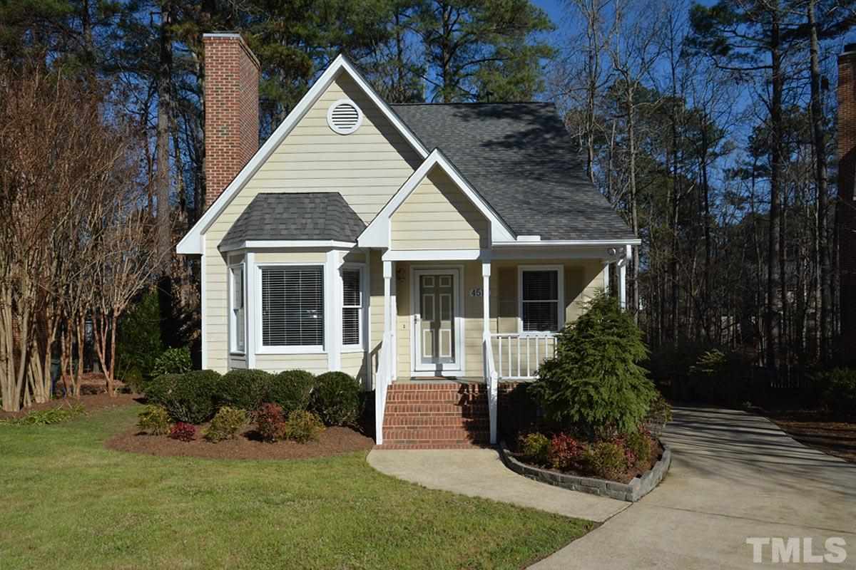 4517 Emmit Drive Raleigh, NC 27604 - Photo 1 of 25 a front view of a house with a yard and trees