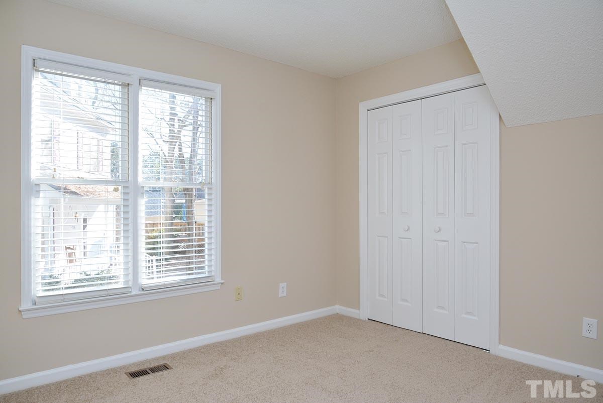 4517 Emmit Drive Raleigh, NC 27604 - Photo 15 of 25 a view of an empty room with a window