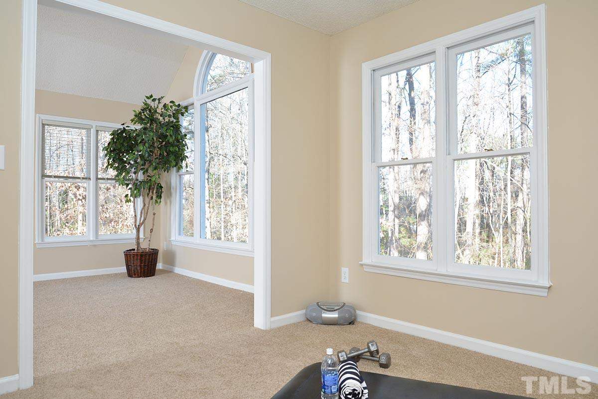 4517 Emmit Drive Raleigh, NC 27604 - Photo 16 of 25 a living room with furniture and a window