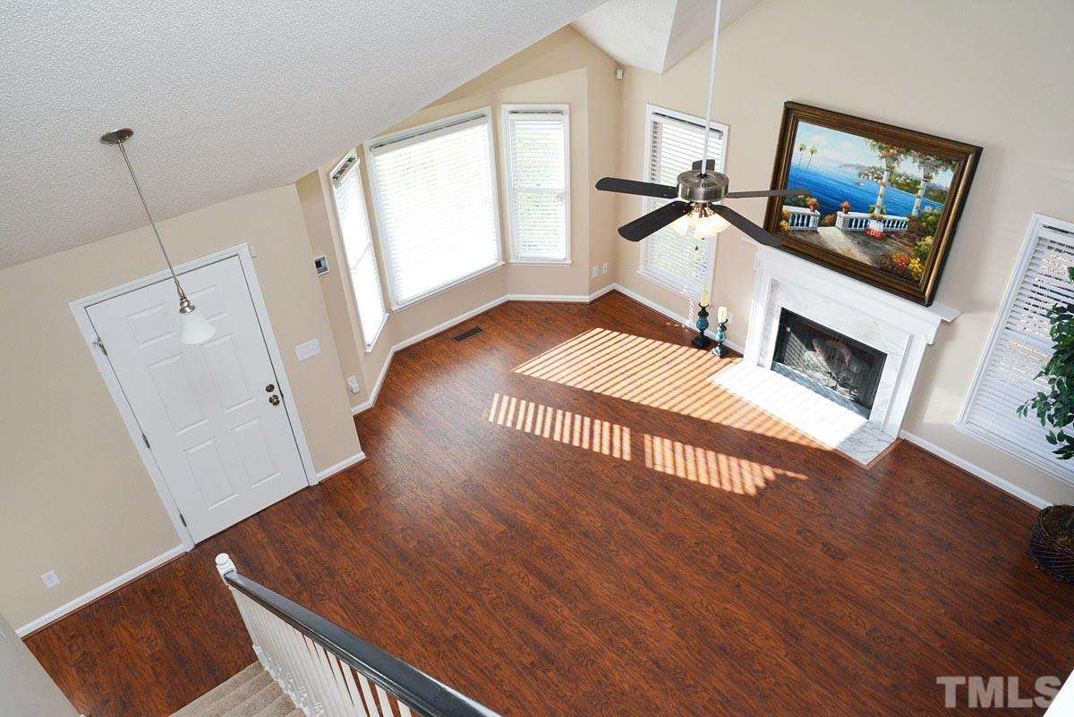 4517 Emmit Drive Raleigh, NC 27604 - Photo 5 of 25 a living room with furniture and a flat screen tv
