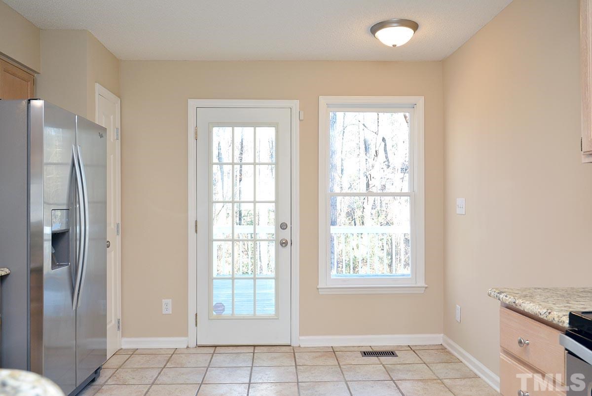 4517 Emmit Drive Raleigh, NC 27604 - Photo 8 of 25 a view of an empty room with window and refrigerator