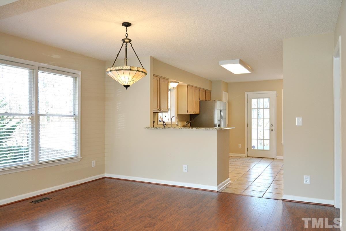 4517 Emmit Drive Raleigh, NC 27604 - Photo 9 of 25 a view of a room with wooden floor and windows