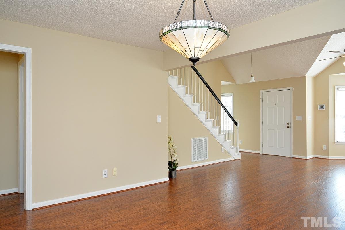 4517 Emmit Drive Raleigh, NC 27604 - Photo 10 of 25 a view of an entryway with wooden floor