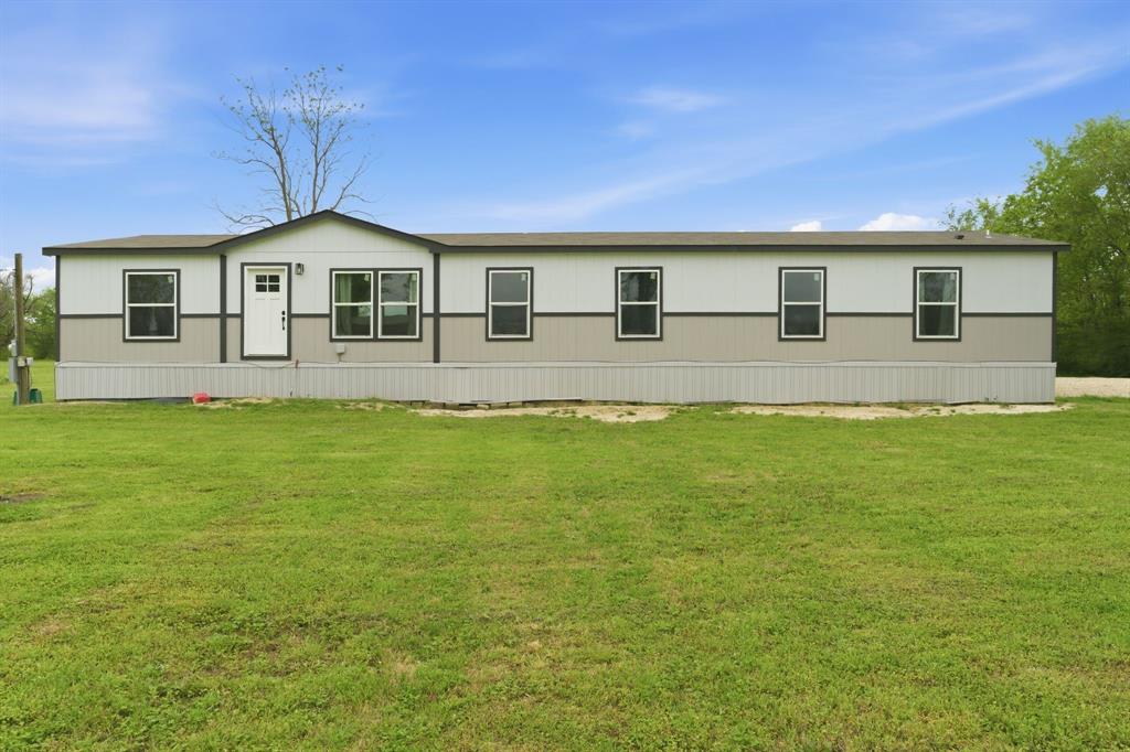 8792 Highway 67 Saltillo, TX 75478 - Photo 3 of 40 a front view of a house with a yard