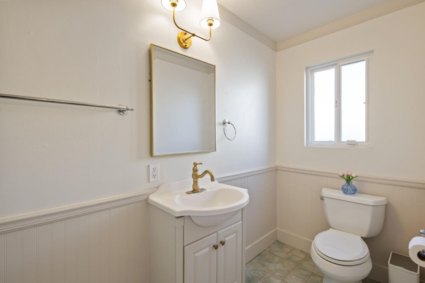 3959 Purdue Way Livermore, CA 94550 - Photo 18 of 23 a bathroom with a toilet a sink and mirror
