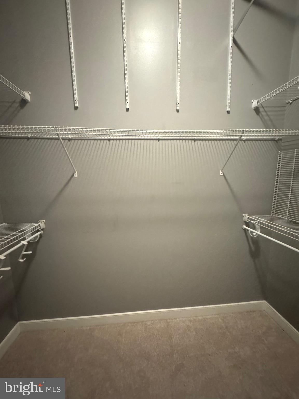 157 Fleet Street, Unit PH14 Oxon Hill, MD 20745 - Photo 14 of 27 a view of a room with racks on the wall