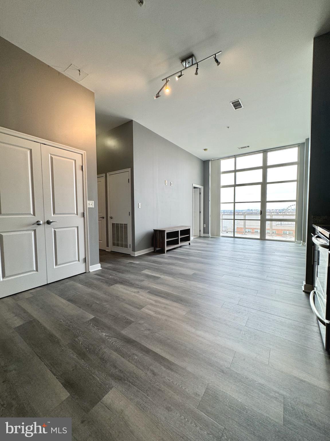 157 Fleet Street, Unit PH14 Oxon Hill, MD 20745 - Photo 5 of 27 a view of an empty room with a window