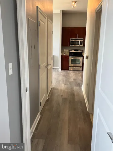a bathroom with a sink toilet and a mirror