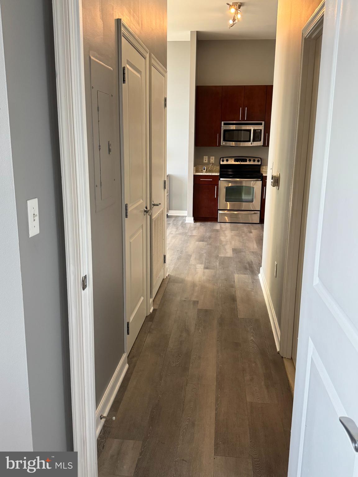 157 Fleet Street, Unit PH14 Oxon Hill, MD 20745 - Photo 8 of 27 a view of a kitchen from the hallway