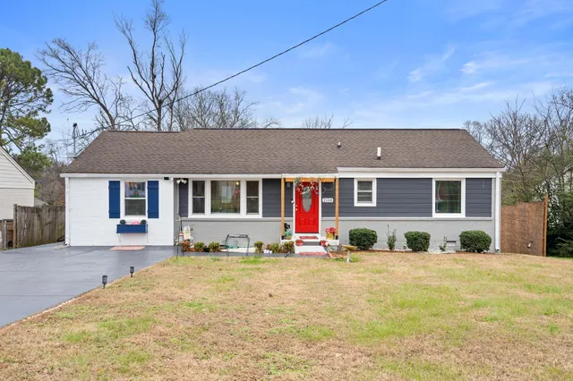 a front view of a house with a yard