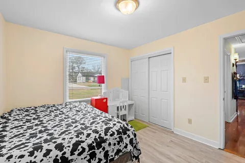 a dining room with furniture and a chandelier