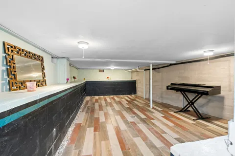 a view of a living room hardwood and kitchen