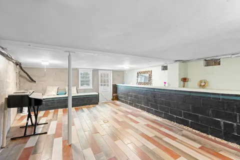 a terrace view with wooden floor and fence