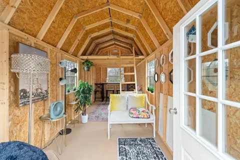 a house with huge green field in front of it