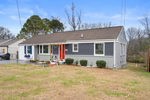 a backyard of a house with seating space
