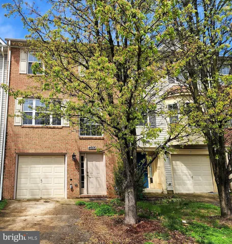 a front view of a house with yard