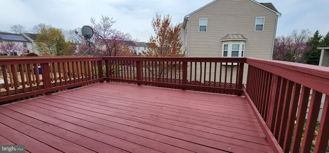 a view of a wooden roof with wooden floor and fence