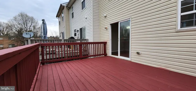 a view of a wooden balcony with wooden floor