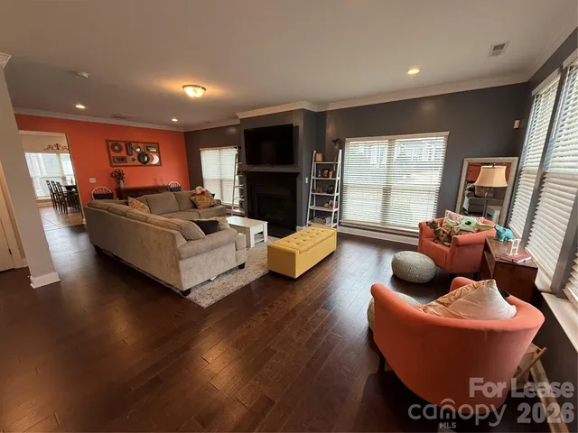 a living room with furniture window and a fireplace