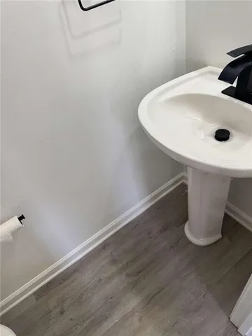 a bathroom with a sink and mirror