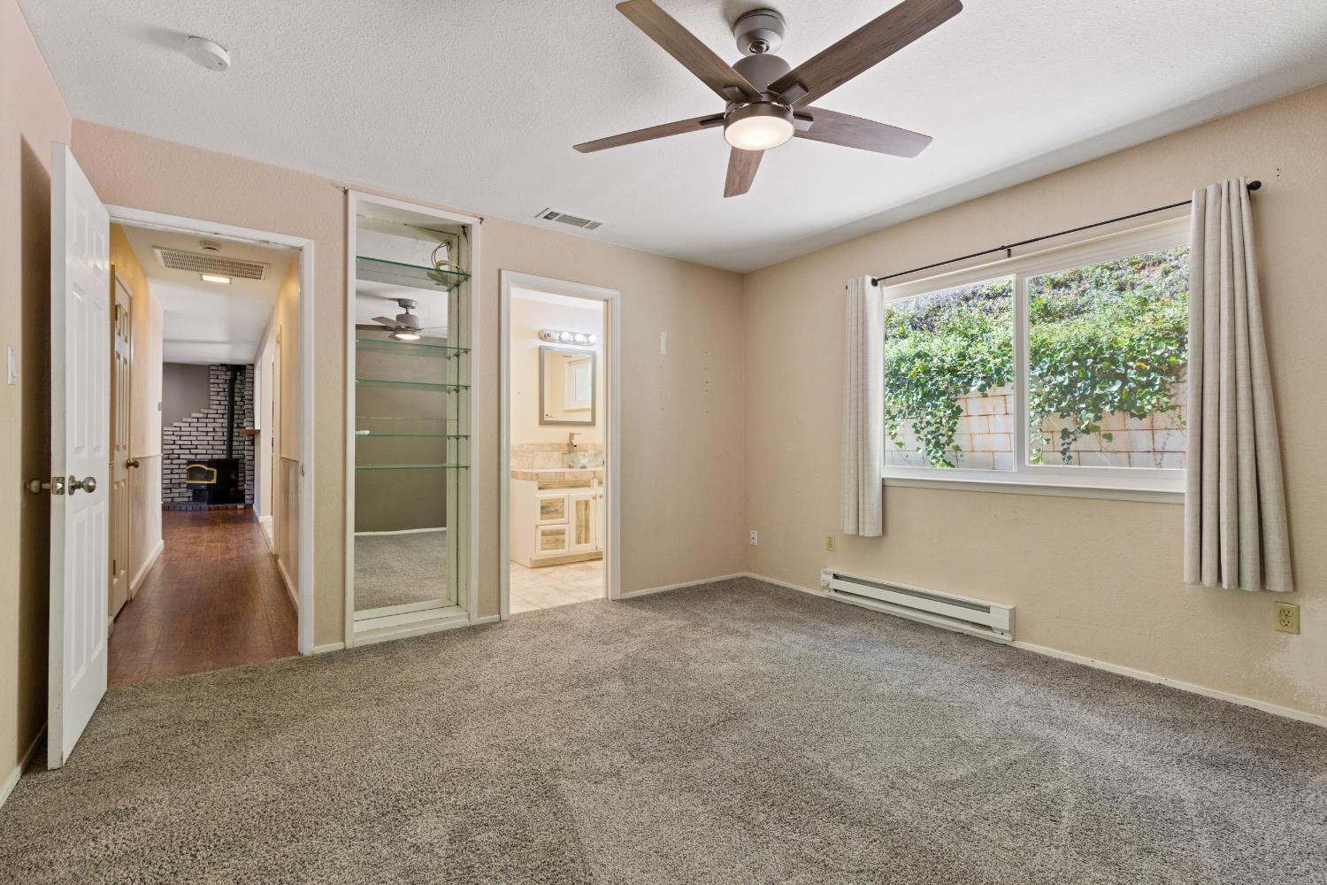 2971 Letitia Avenue Placerville, CA 95667 - Photo 54 of 65 an empty room with chandelier fan and windows