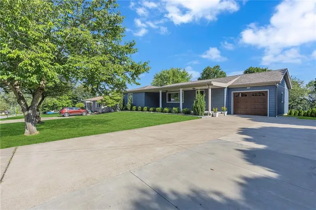 a view of house with a yard