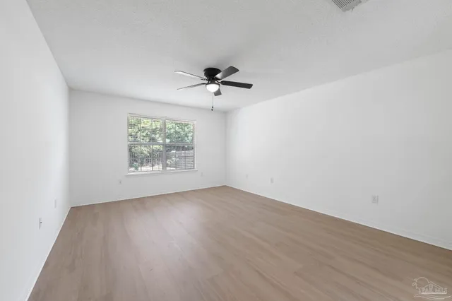 a bathroom with a double vanity sink mirror and shower