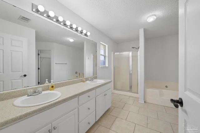 a view of bathroom with bathtub and window