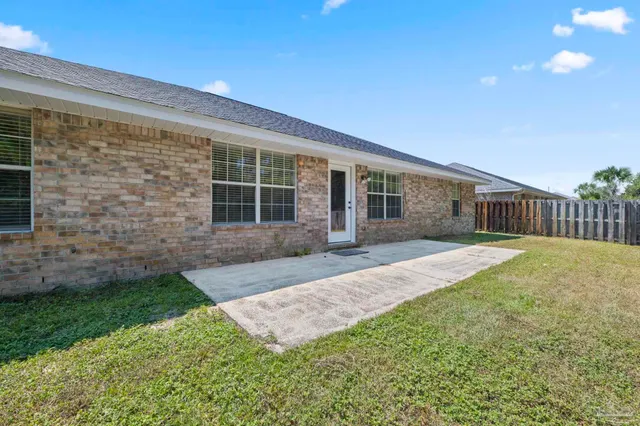 a front view of a house with a garden and porch
