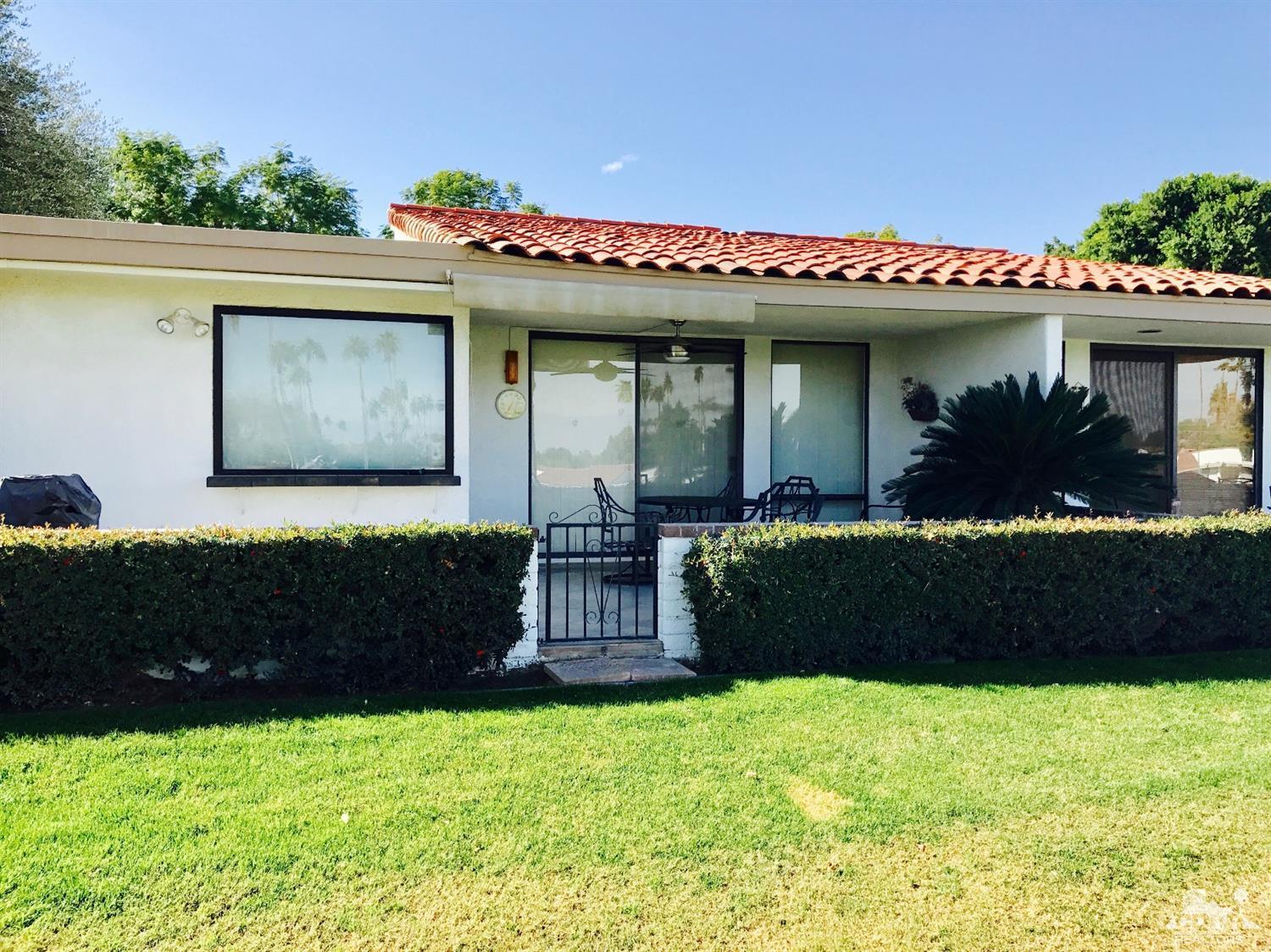 95 Calle Encinitas Rancho Mirage, CA 92270 - Photo 2 of 9 a front view of a house with a yard