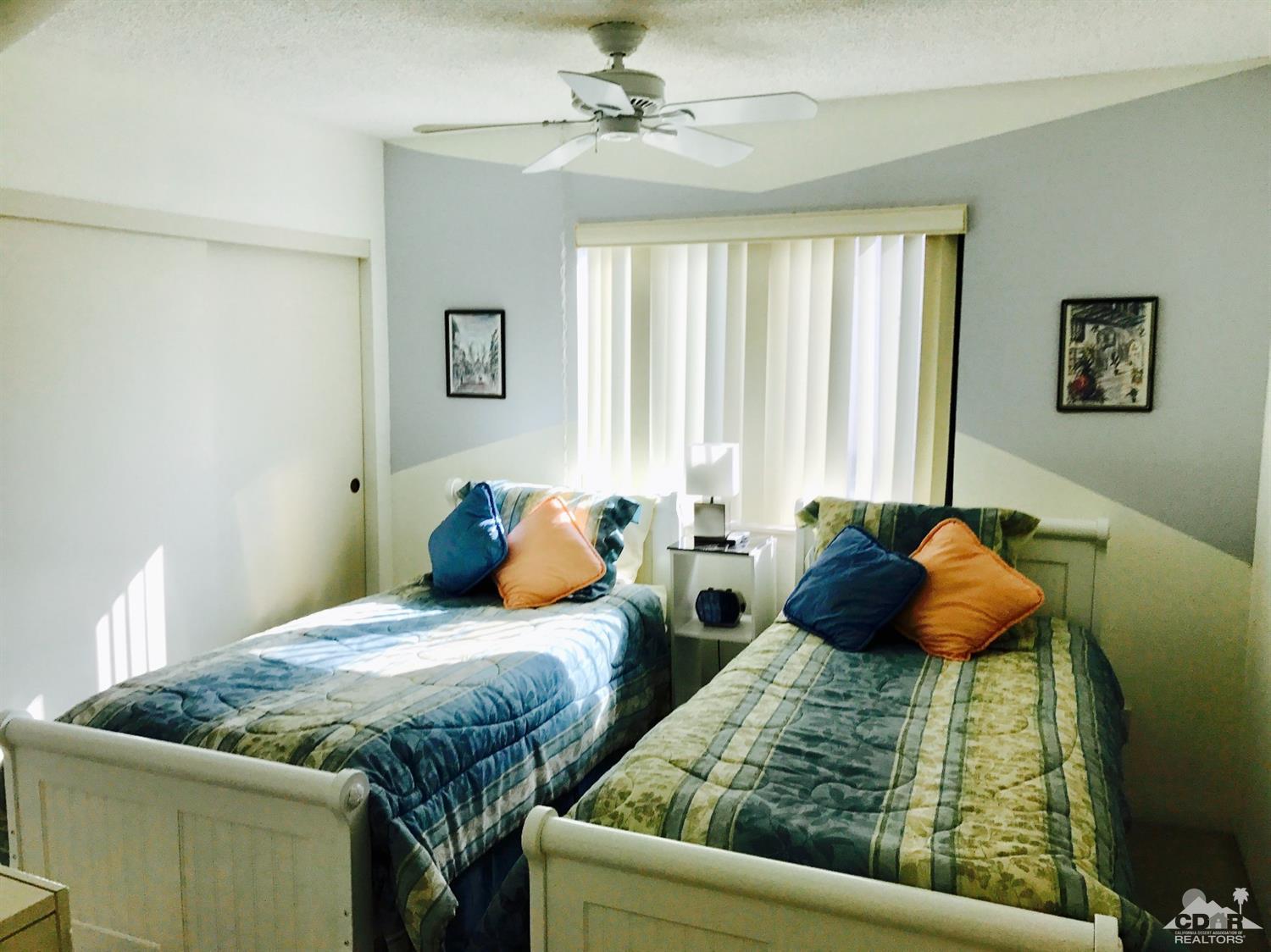 95 Calle Encinitas Rancho Mirage, CA 92270 - Photo 7 of 9 a bedroom with two bed and a window