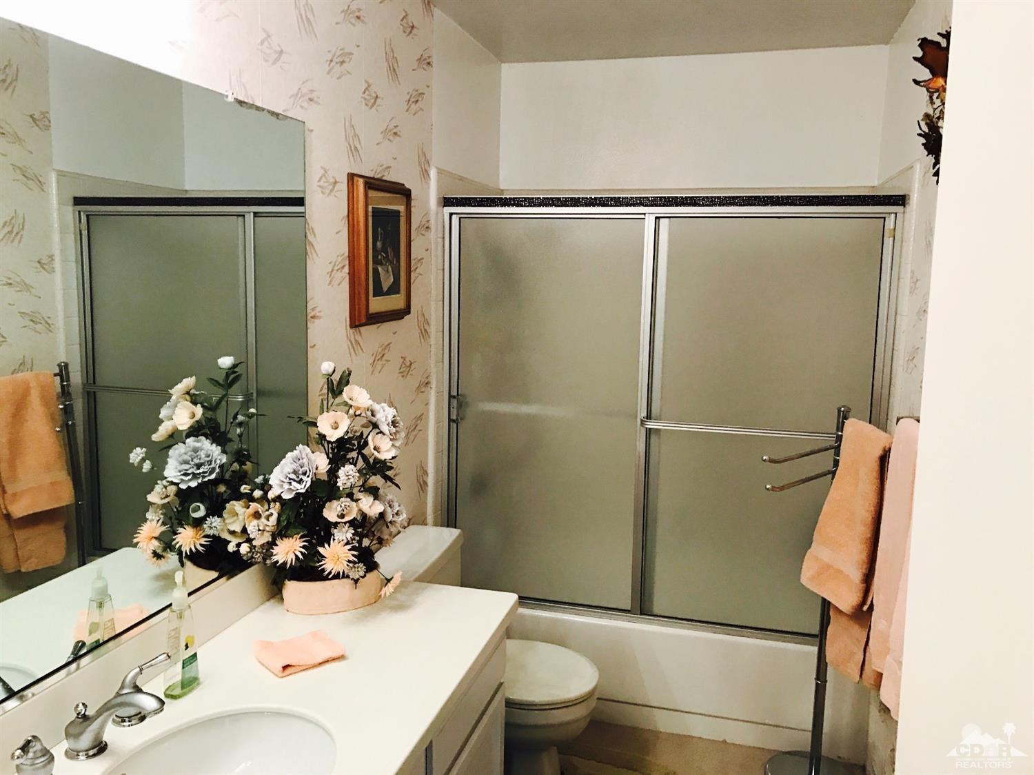 95 Calle Encinitas Rancho Mirage, CA 92270 - Photo 8 of 9 a bathroom with a sink toilet and shower
