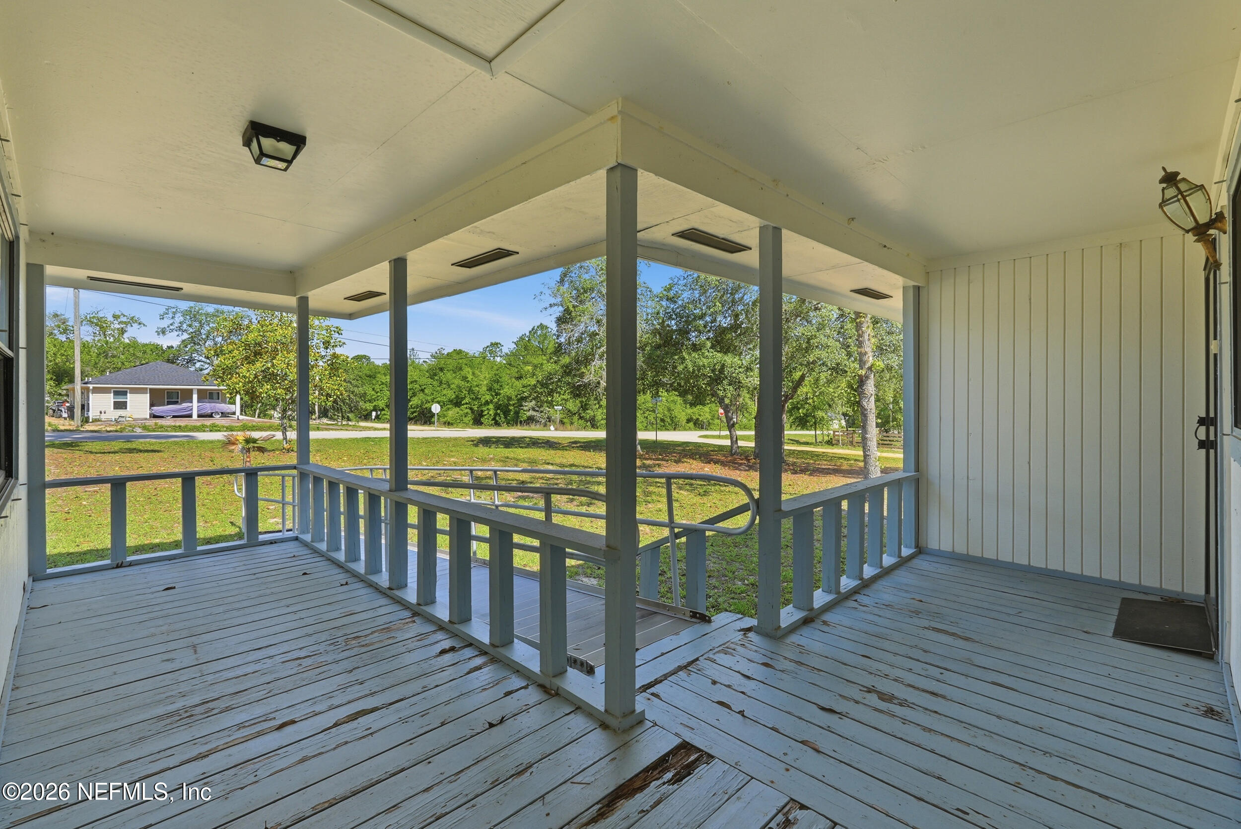 7593 Silver Sands Road Keystone Heights, FL 32656 - Photo 4 of 36 a view of a balcony with wooden floor