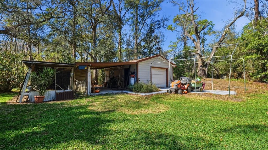 10565 Bessemer Street New Port Richey, FL 34654 - Photo 35 of 72 a view of a house with a yard and sitting area
