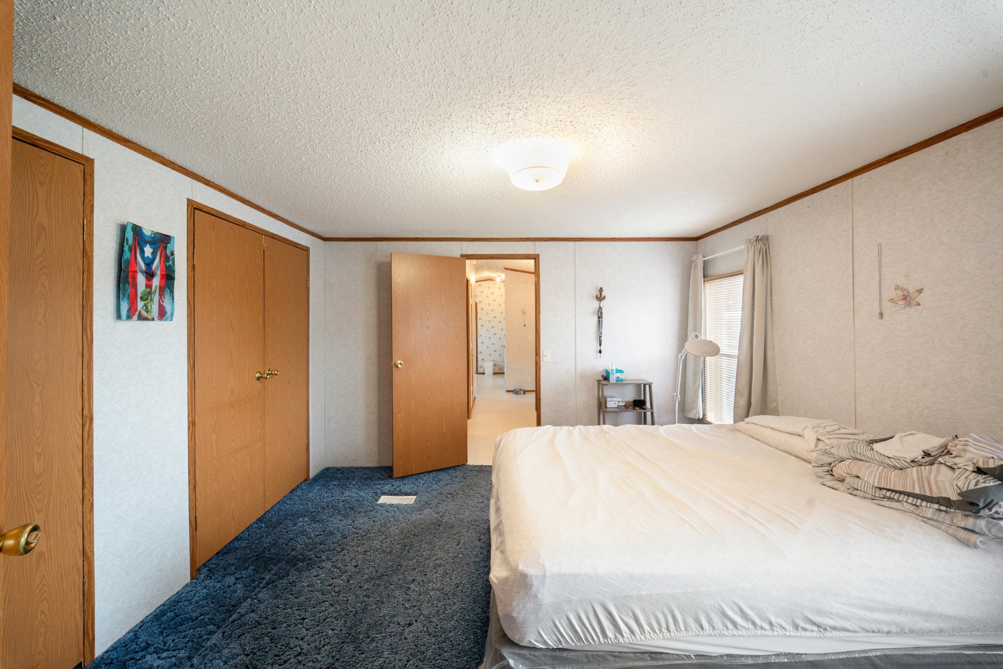 1777 Pond River Road Elkton, KY 42220 - Photo 15 of 21 a spacious bedroom with a large bed and a walk in closet