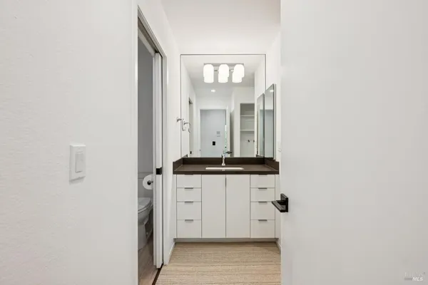 a view of a kitchen from the hallway